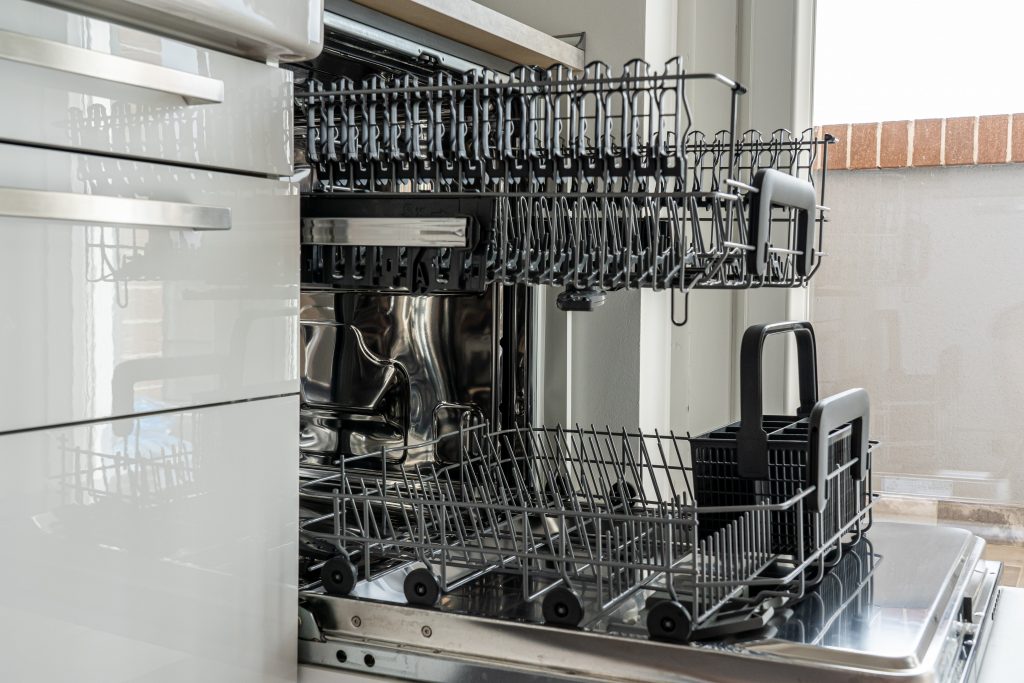 a clean, opened dishwasher